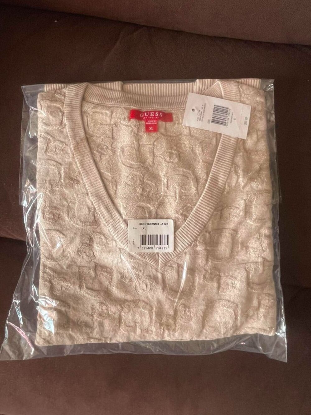 Guess v-neck sweater in a light tan or beige color